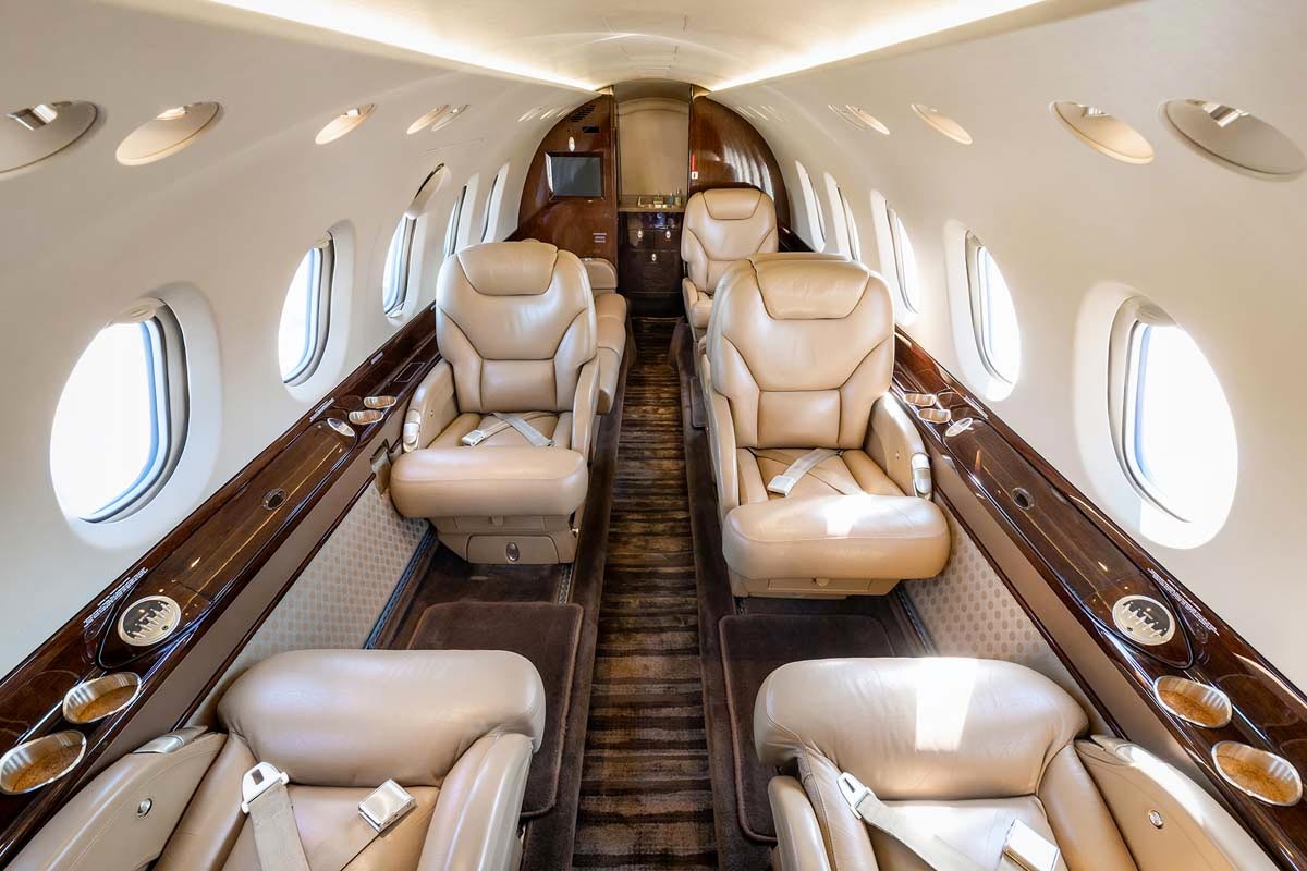 Hawker 800XP charter private jet cabin interior photo 1 of 5