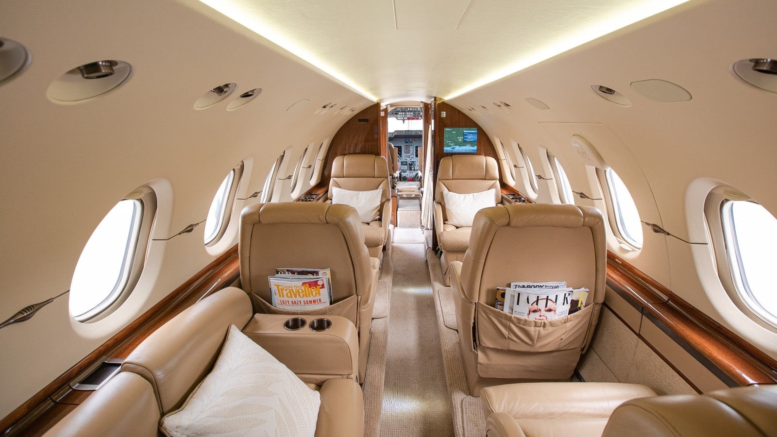 Hawker 900XP charter private jet cabin interior photo 1 of 4
