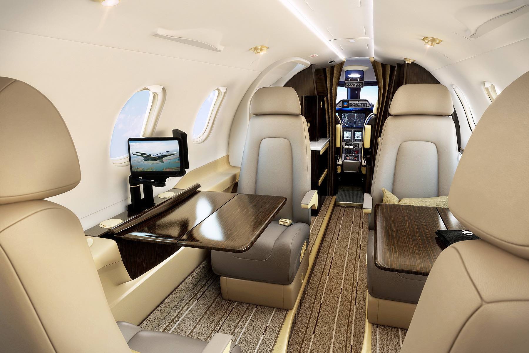 Phenom 300 charter private jet cabin interior photo 1 of 3
