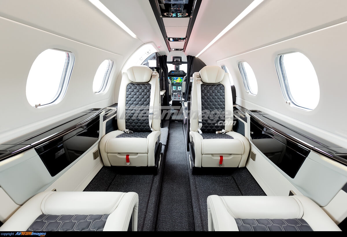 Phenom 300 charter private jet cabin interior thumbnail 2