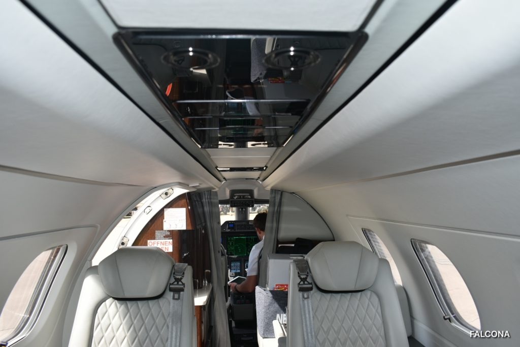 Phenom 300E charter private jet cabin interior thumbnail 2