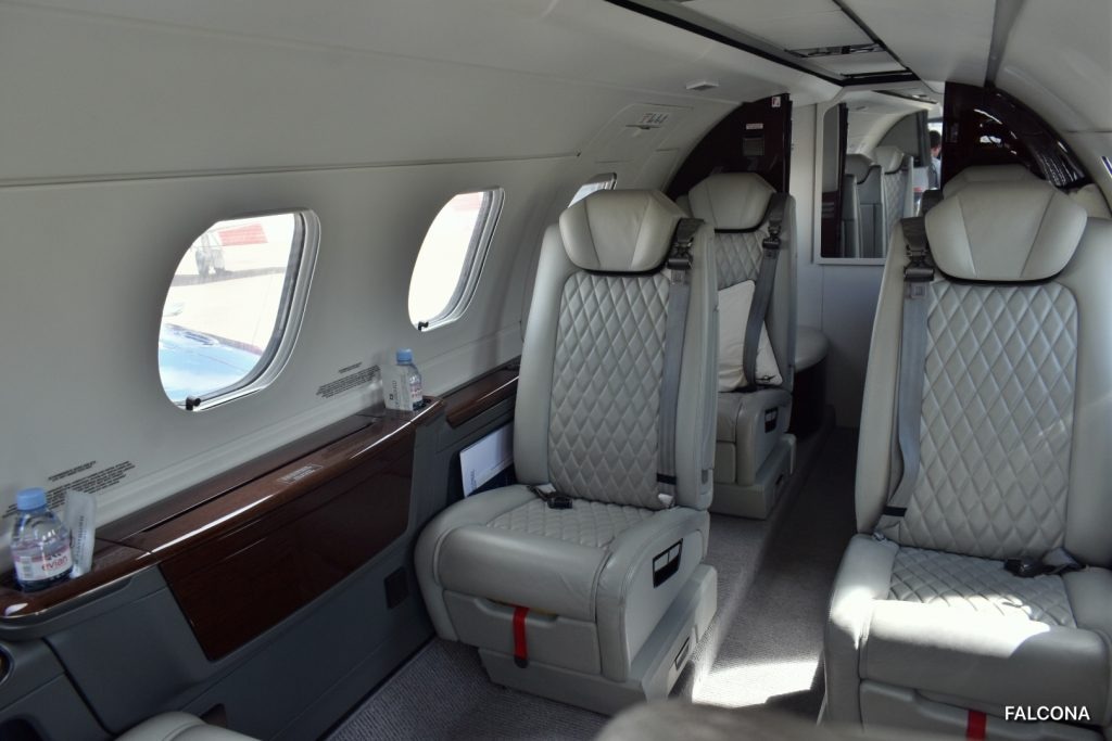 Phenom 300E charter private jet cabin interior thumbnail 3