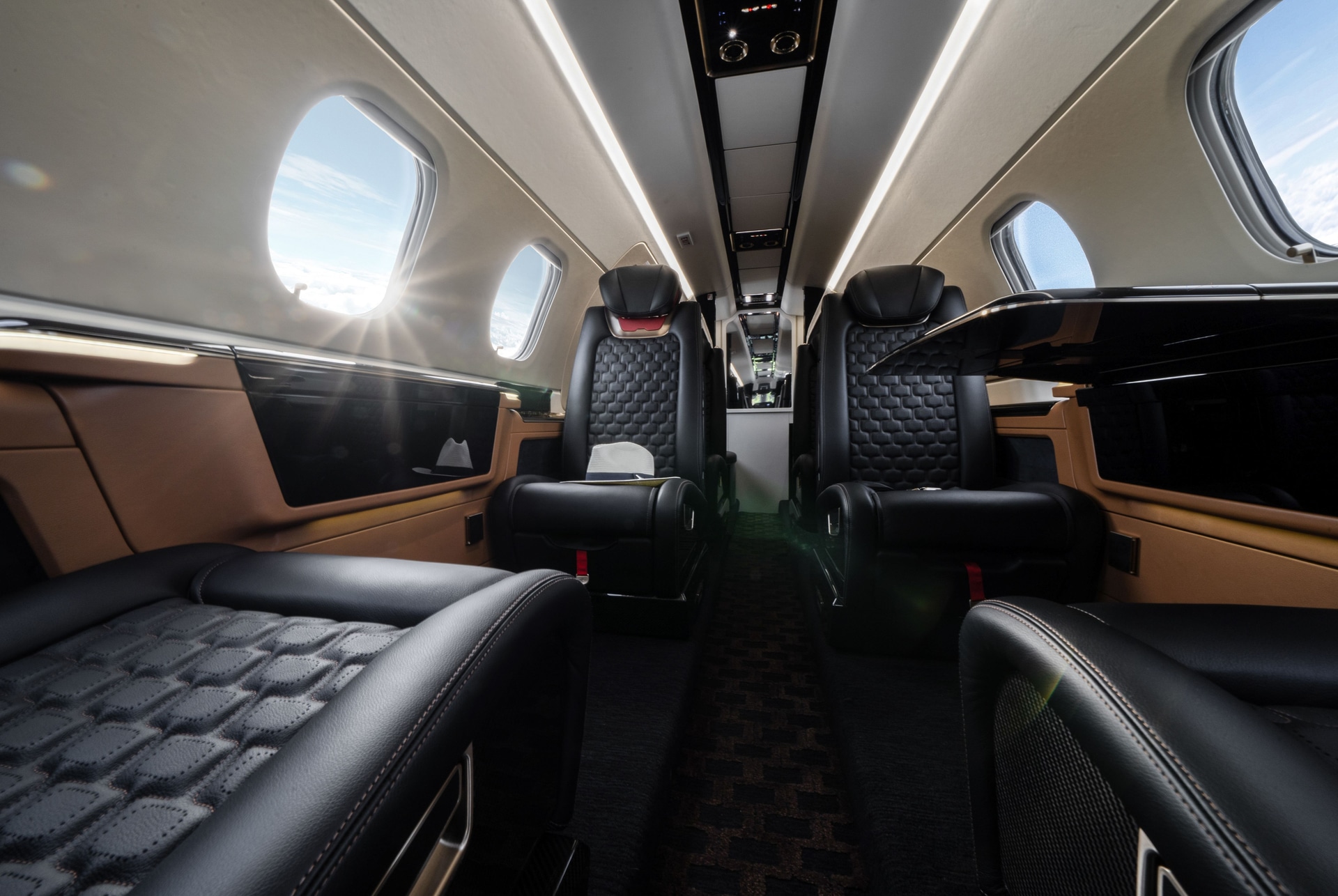 Phenom 300E charter private jet cabin interior thumbnail 4